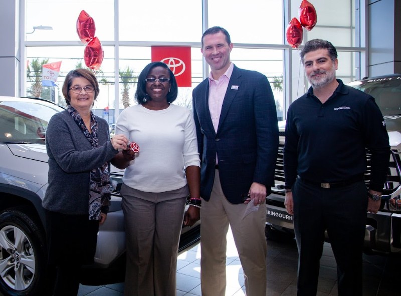 Veteran is given car keys at a Toyota dealership