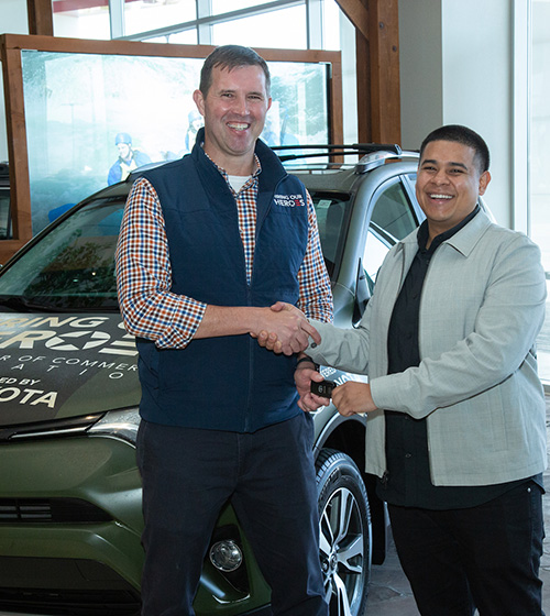 Hiring Our Heroes President Eric Eversole hands car keys to this Air Force veteran