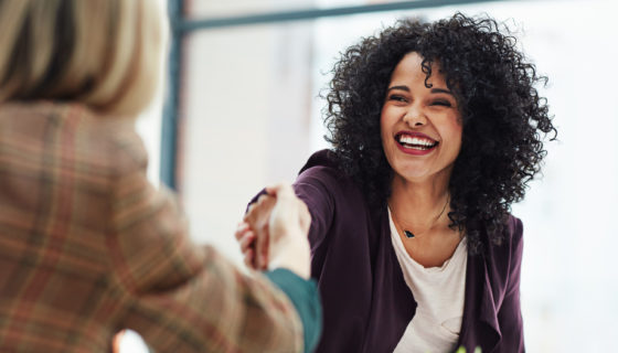 New hire shaking hands at a job interview