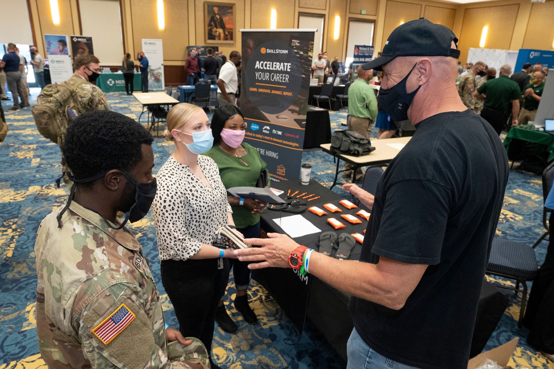 Job seekers talk to employer at Fort Bragg