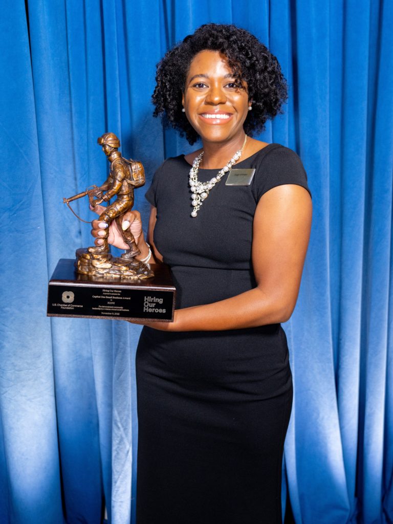 Angel Johnson holds Hiring Our Heroes award