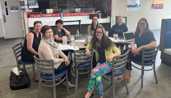 A group of military spouses sit at a table