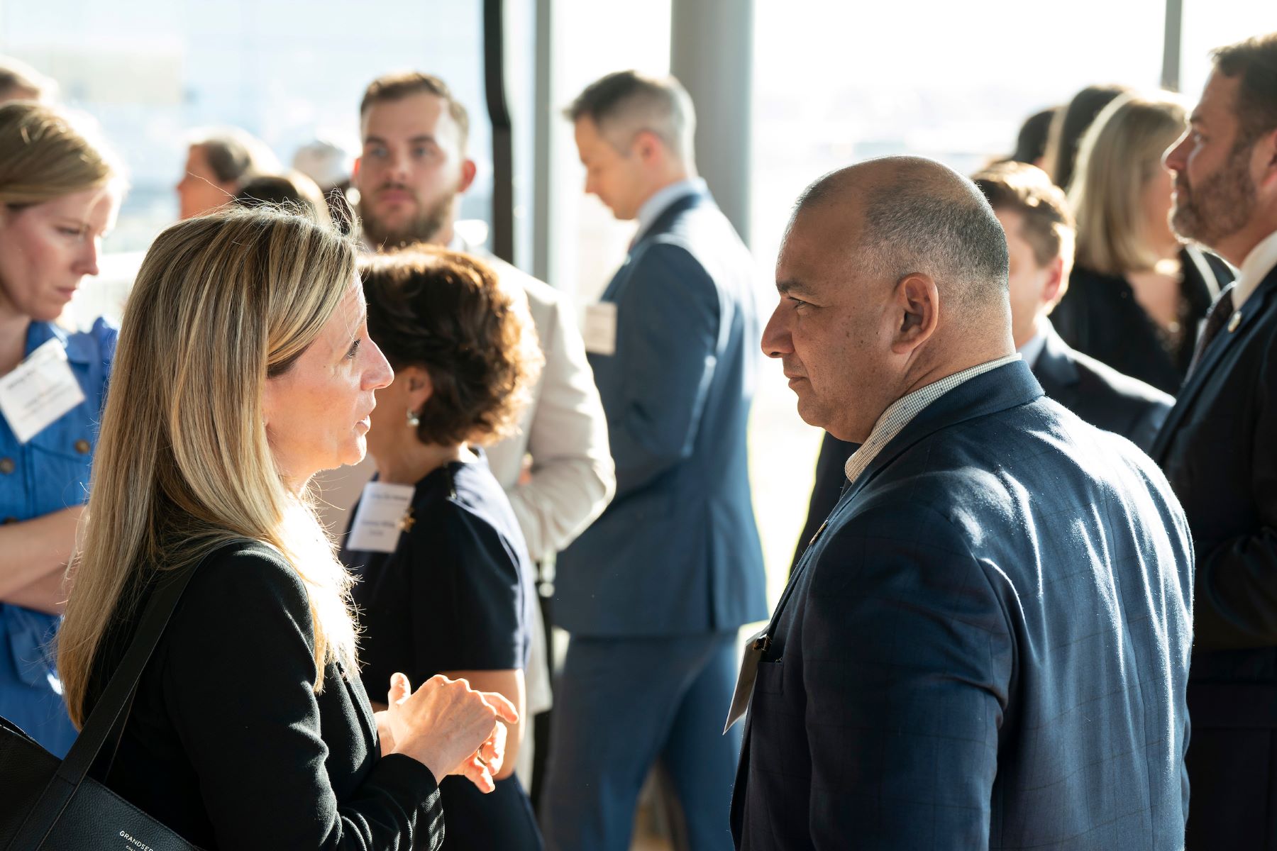 Business leaders talking at a networking reception
