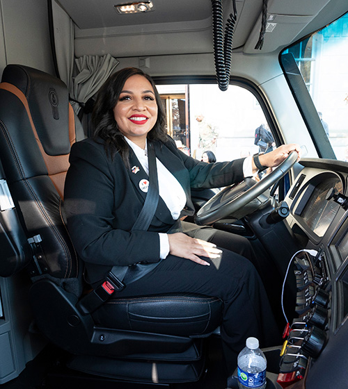 Transition Trucking giveaway winner inside the cab of her new truck