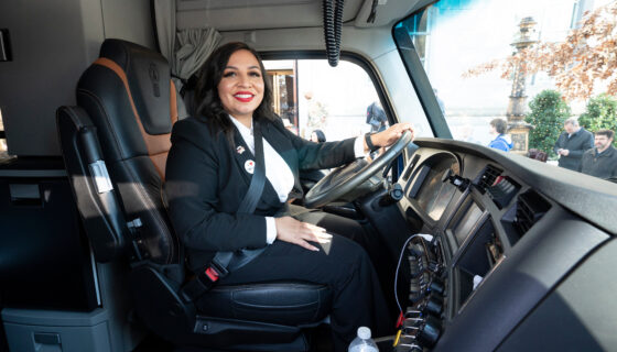Army veteran Ashley Leiva at the wheel of brand-new fully loaded Kenworth T680 truck
