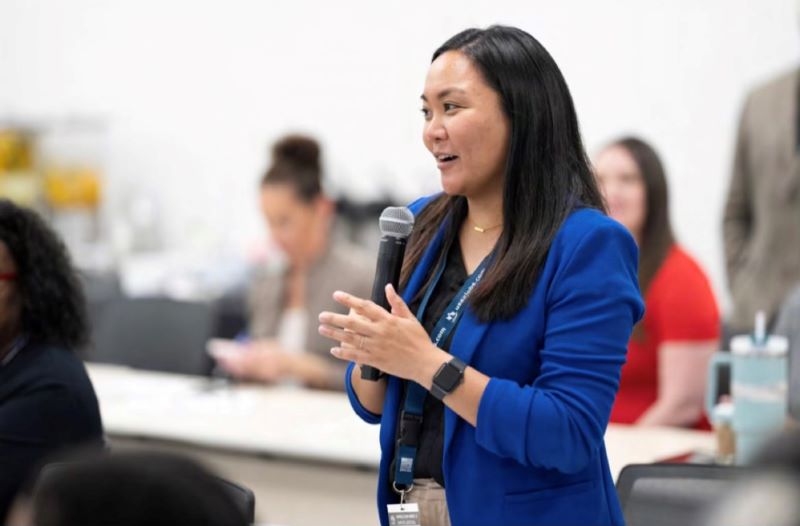 Janine Santiago speaks at an event