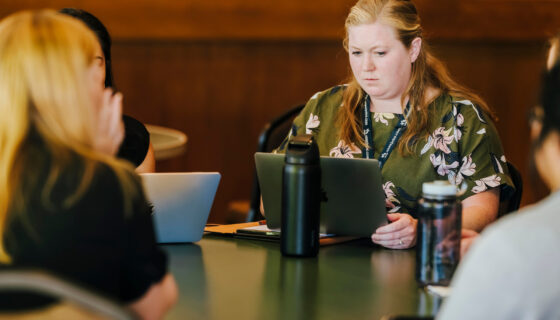 Women sit around a table during Hiring Our Heroes event