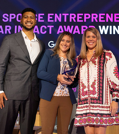Owner, Always Faithful Cleaning, and Military Spouse Entrepreneur of The Year Impact Award Winner, Hallie Hattabaugh (center) poses with the award at the Hiring Our Heroes 2025 Military Spouse Employment Summit.