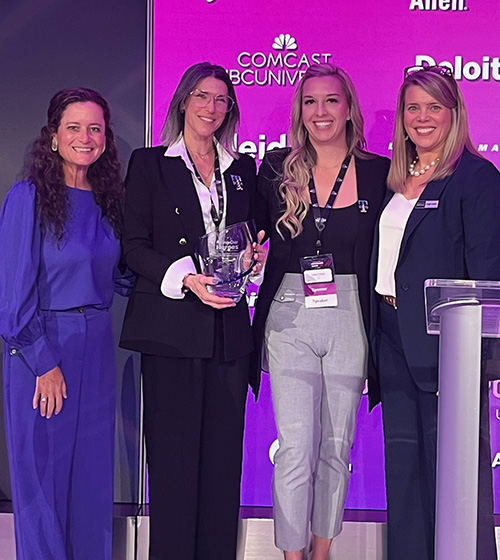 Representatives from T-Mobile accept an award from Hiring Our Heroes, posing alongside Senior VP Elizabeth O'Brien and HOH Consultant Angie Hood.