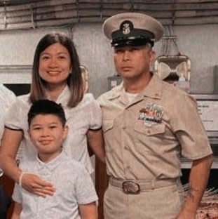 Navy Spouse Arra with her service member and child.