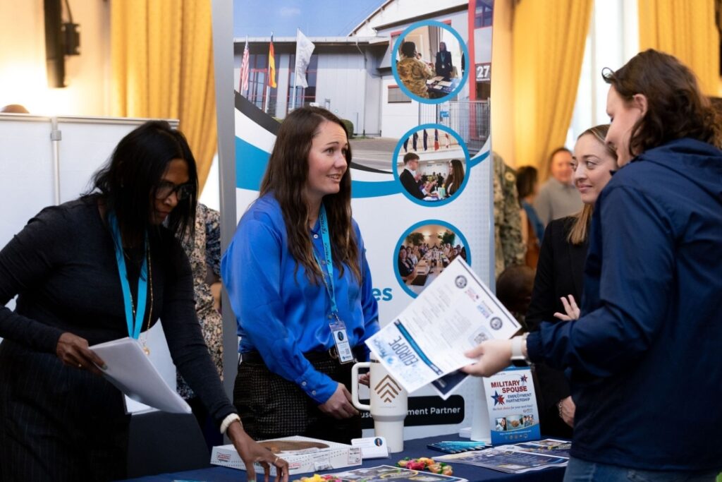 Military-friendly employers interact with participants at Career Summit job fair in Europe.