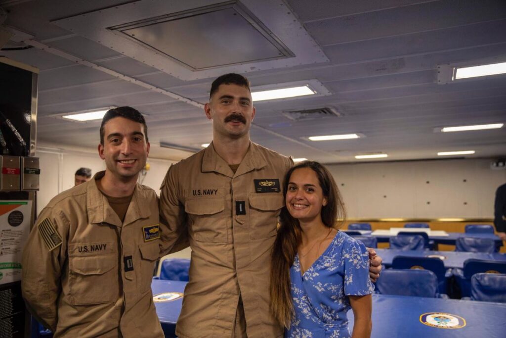 Karen Uhlhorn (right) and husband, Cutter Uhlhorn (center), at his SWO pinning.