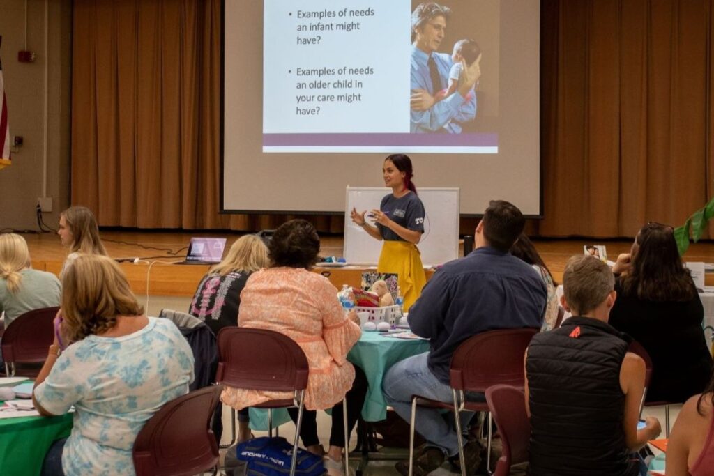 Karen Uhlhorn speaks to crowd as part of her nonprofit leadership role before pivoting to a new career.