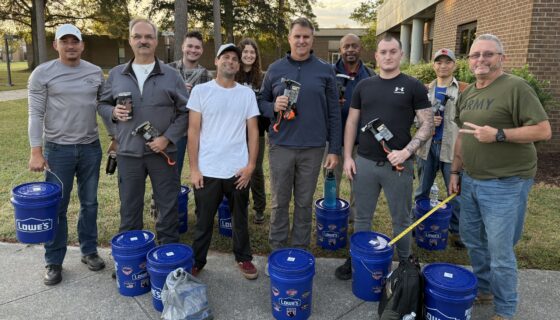 STA cohort 1 members posing with Lowes tools
