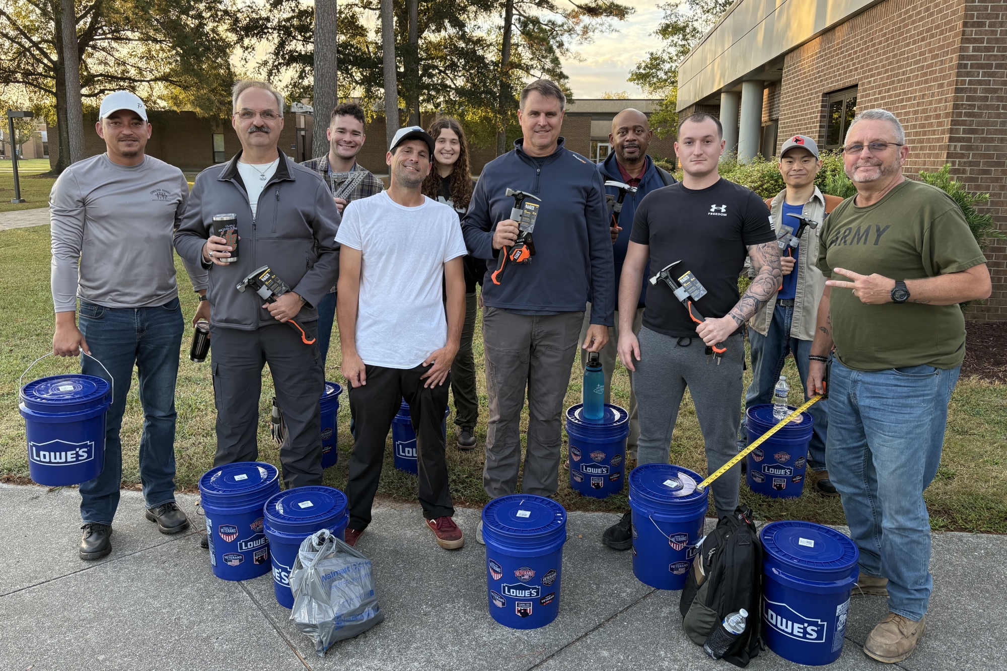 STA cohort 1 members posing with Lowes tools