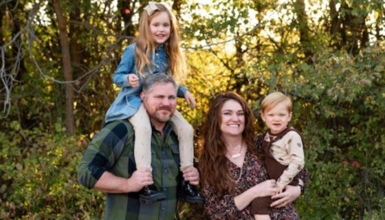 Gary Connor posing with his wife and two children.