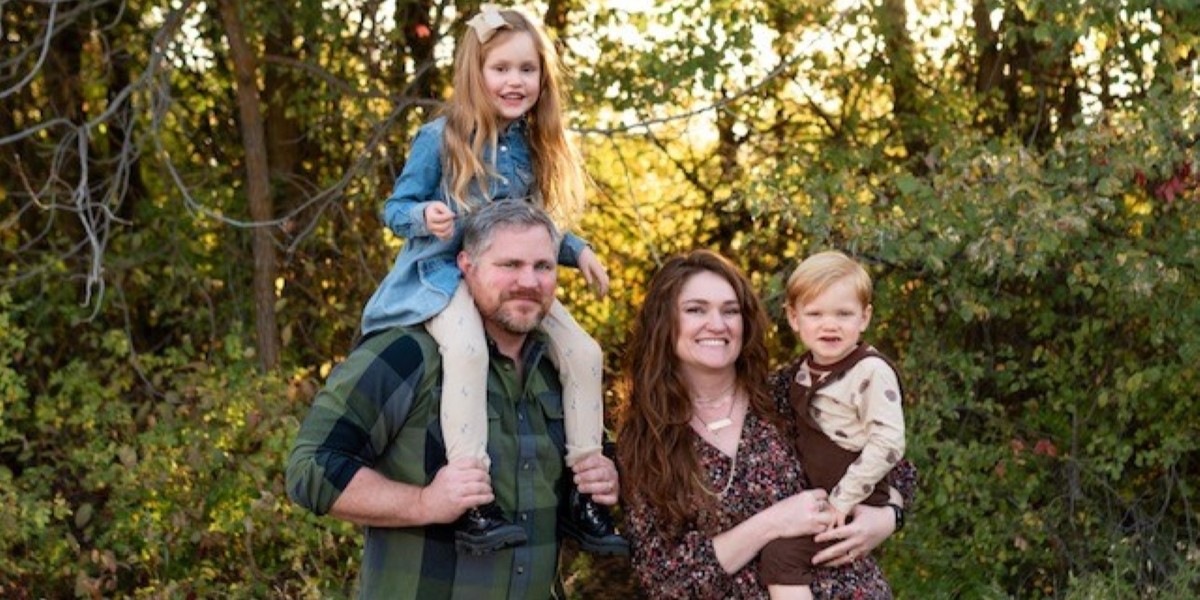 Gary Connor posing with his wife and two children.