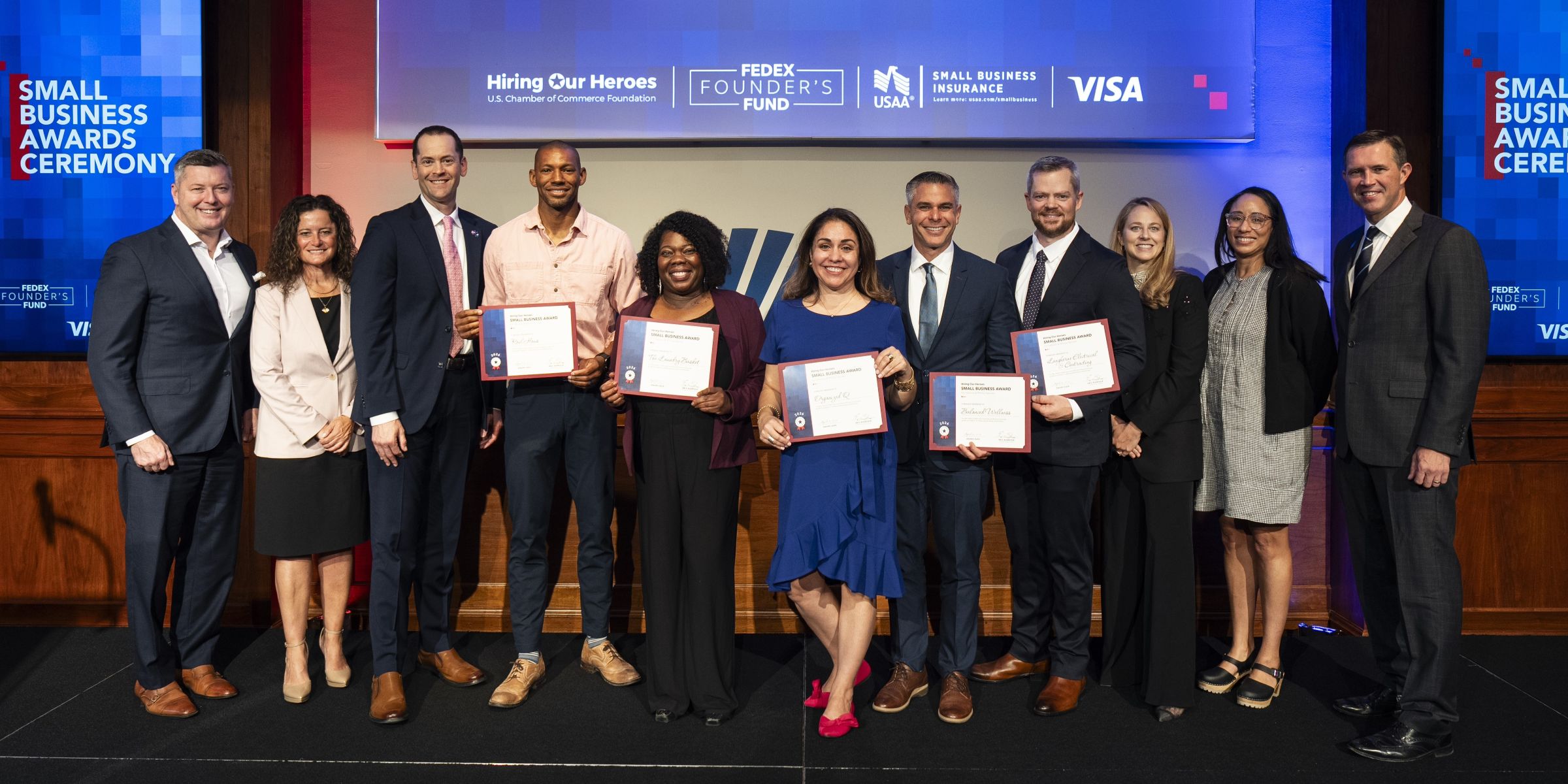 2026 Small Business Award recipients pose with sponsors. From left to right: The Honorable Patrick Murphy, Elizabeth O'Brien, Nate Summers, Donny Legans, Hyacinth Tucker, Gabi Bell, Savier Roman, Elijah Langhorne, Samantha Smith Atkinson, Gen Harrison-Doss, and Eric Eversole