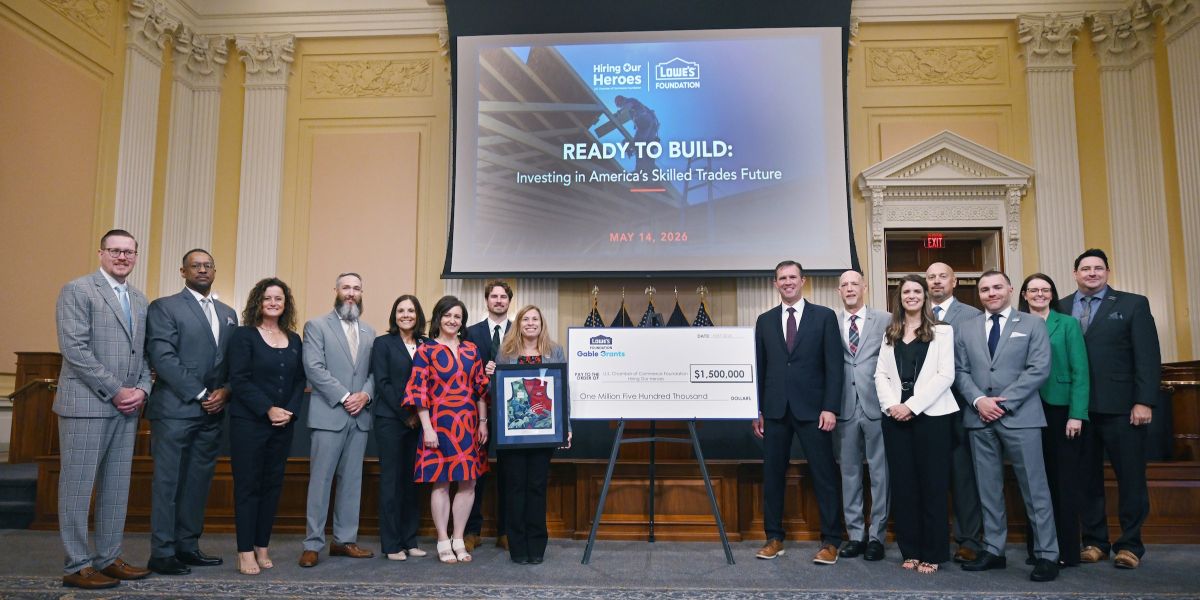 Representatives from Lowe's Foundation and Hiring Our Heroes pose with a $1.5M commemorative check during a historic grant ceremony.