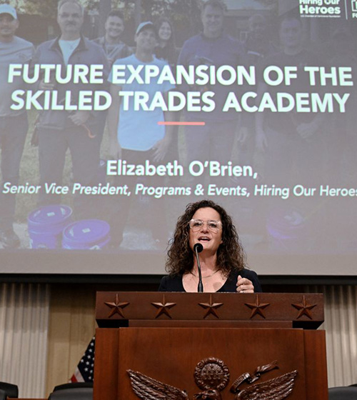 Elizabeth O'Brien, Senior Vice President of Programs & Events at Hiring Our Heroes, speaks to an audience about the expansion of the Skills Trades Academy.