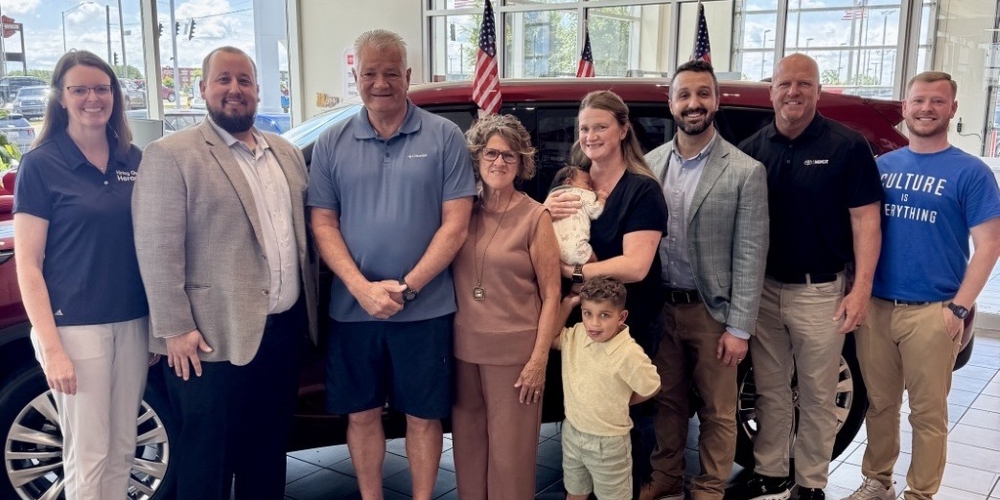 2026 winner Steve Lawrence posing with his family and representatives from the Toyota dealership and Hiring Our Heroes in front of his new Toyota Highlander.