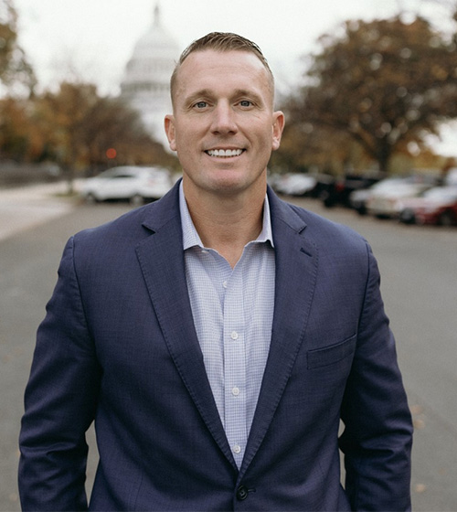 Dakota Meyer smiling with the capital building in the background