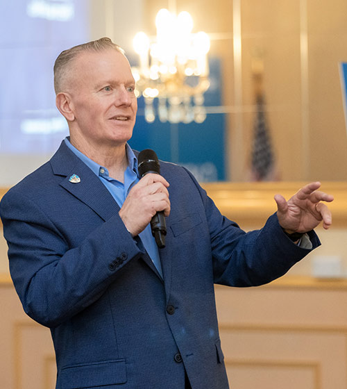 Hiring Our Heroes Ambassador John Wayne Troxell speaking at an event.