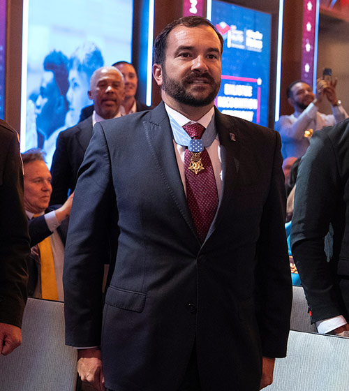 Hiring Our Heroes Ambassador Sal Giunta poses for a photo at an event.