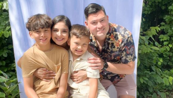 Marina poses with her husband and two children.