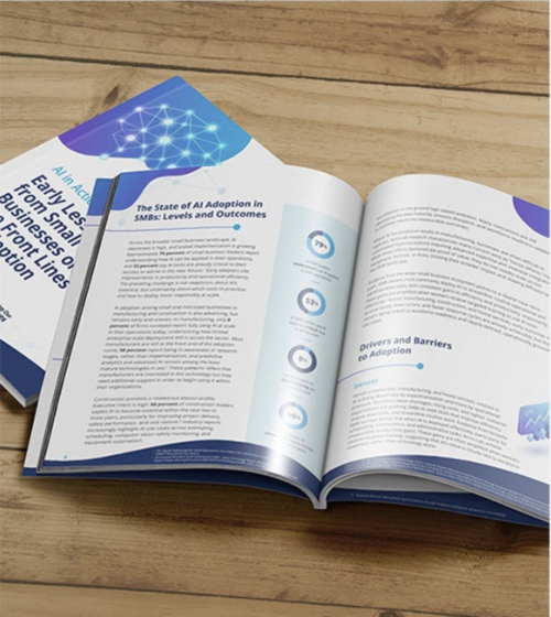 A copy of the report "AI in Action" lays open on a table