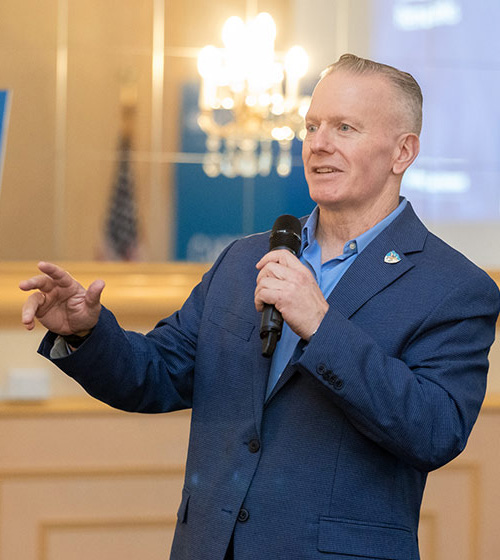 Hiring Our Heroes Ambassador John Wayne Troxell speaking at an event.